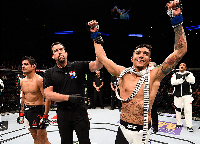 MONTERREY, MEXICO - NOVEMBER 21: Andre Fili of the United States celebrates after his knockout victory over Gabriel Benitez of Mexico in their featherweight bout during the UFC Fight Night event at Arena Monterrey on November 21, 2015 in Monterrey, Mexic