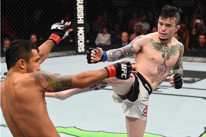 MONTERREY, MEXICO - NOVEMBER 21:  (R-L) Scott Jorgensen of the United States kicks Alejandro Perez of Mexico in their bantamweight bout during the UFC Fight Night event at Arena Monterrey on November 21, 2015 in Monterrey, Mexico.  (Photo by Jeff Bottari/