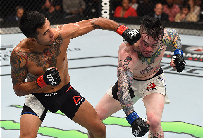 MONTERREY, MEXICO - NOVEMBER 21:  (L-R) Alejandro Perez of Mexico punches Scott Jorgensen of the United States in their bantamweight bout during the UFC Fight Night event at Arena Monterrey on November 21, 2015 in Monterrey, Mexico.  (Photo by Jeff Bottar