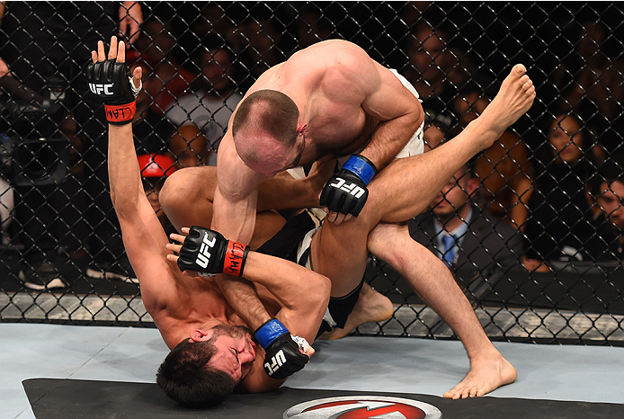 MONTERREY, MEXICO - NOVEMBER 21: (R-L) Bartosz Fabinski of Poland punches Hector Urbina of Mexico in their welterweight bout during the UFC Fight Night event at Arena Monterrey on November 21, 2015 in Monterrey, Mexico. (Photo by Jeff Bottari/Zuffa LLC/