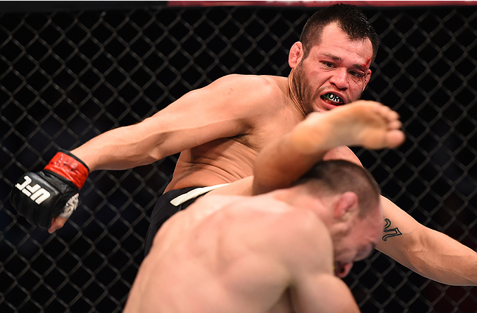 MONTERREY, MEXICO - NOVEMBER 21: (L-R) Hector Urbina of Mexico kicks Bartosz Fabinski of Poland in their welterweight bout during the UFC Fight Night event at Arena Monterrey on November 21, 2015 in Monterrey, Mexico. (Photo by Jeff Bottari/Zuffa LLC/Zu