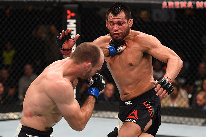 MONTERREY, MEXICO - NOVEMBER 21: (L-R) Bartosz Fabinski of Poland punches Hector Urbina of Mexico in their welterweight bout during the UFC Fight Night event at Arena Monterrey on November 21, 2015 in Monterrey, Mexico. (Photo by Jeff Bottari/Zuffa LLC/