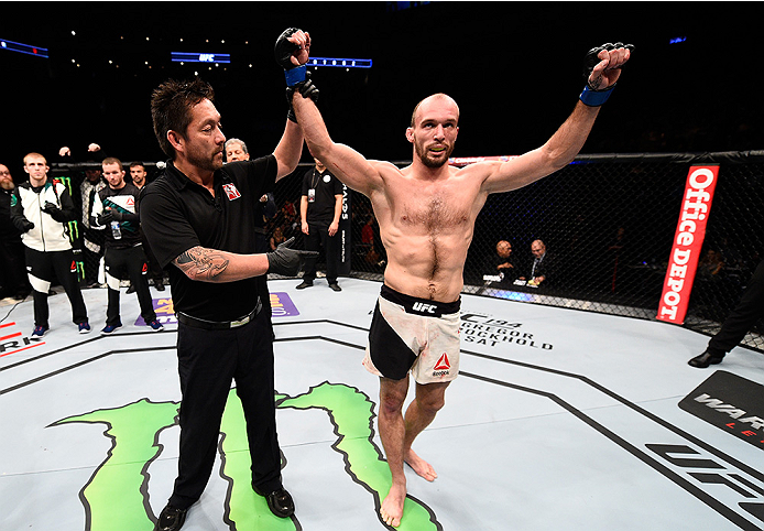 MONTERREY, MEXICO - NOVEMBER 21:  Bartosz Fabinski of Poland celebrates after his victory over Hector Urbina of Mexico in their welterweight bout during the UFC Fight Night event at Arena Monterrey on November 21, 2015 in Monterrey, Mexico.  (Photo by Jef