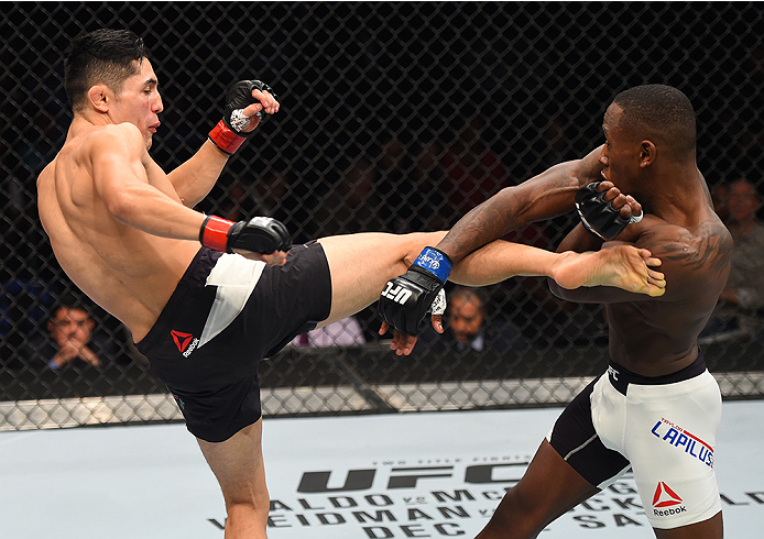 MONTERREY, MEXICO - NOVEMBER 21: (L-R) Erik Perez of Mexico kicks Taylor Lapilus of France in their bantamweight bout during the UFC Fight Night event at Arena Monterrey on November 21, 2015 in Monterrey, Mexico. (Photo by Jeff Bottari/Zuffa LLC/Zuffa L