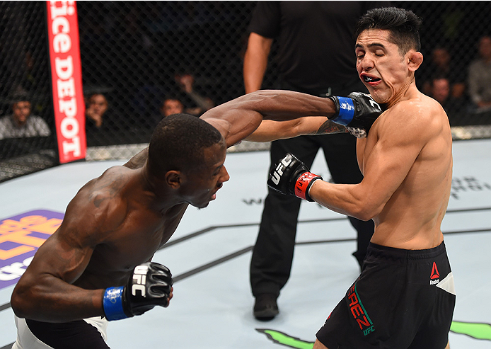 MONTERREY, MEXICO - NOVEMBER 21:  (L-R) Taylor Lapilus of France punches Erik Perez of Mexico in their bantamweight bout during the UFC Fight Night event at Arena Monterrey on November 21, 2015 in Monterrey, Mexico.  (Photo by Jeff Bottari/Zuffa LLC/Zuffa