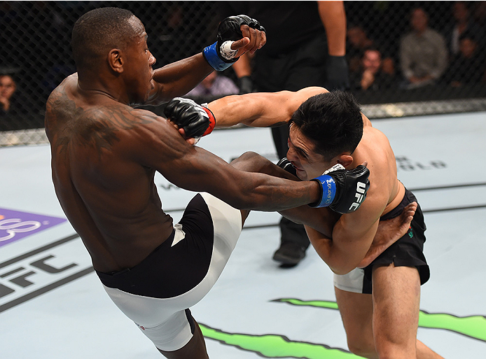 MONTERREY, MEXICO - NOVEMBER 21:  (R-L) Erik Perez of Mexico takes down Taylor Lapilus of France in their bantamweight bout during the UFC Fight Night event at Arena Monterrey on November 21, 2015 in Monterrey, Mexico.  (Photo by Jeff Bottari/Zuffa LLC/Zu