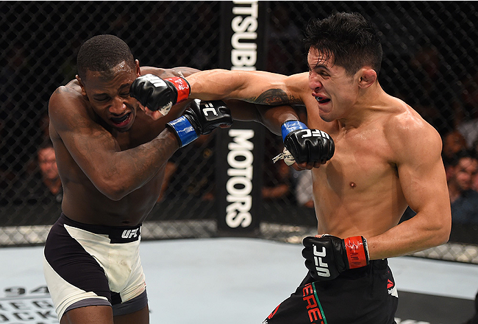 MONTERREY, MEXICO - NOVEMBER 21:  (R-L) Erik Perez of Mexico and Taylor Lapilus of France trade punches in their bantamweight bout during the UFC Fight Night event at Arena Monterrey on November 21, 2015 in Monterrey, Mexico.  (Photo by Jeff Bottari/Zuffa