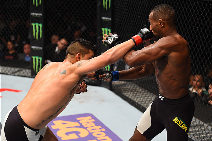 MONTERREY, MEXICO - NOVEMBER 21: (L-R) Efrain Escudero of Mexico punches Leandro Silva of Brazil in their lightweight bout during the UFC Fight Night event at Arena Monterrey on November 21, 2015 in Monterrey, Mexico. (Photo by Jeff Bottari/Zuffa LLC/Zu