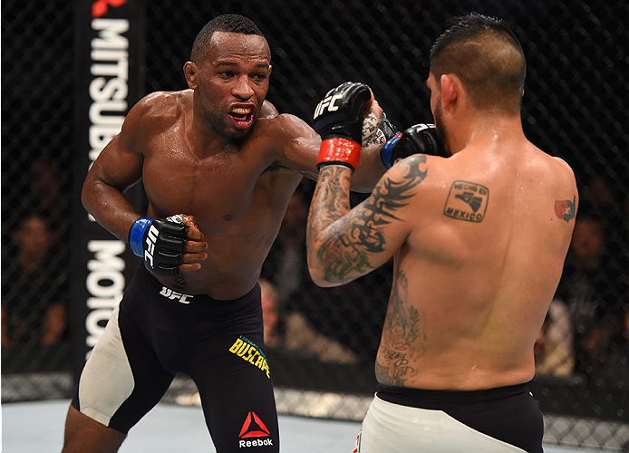 MONTERREY, MEXICO - NOVEMBER 21:  (L-R) Leandro Silva of Brazil punches Efrain Escudero of Mexico in their lightweight bout during the UFC Fight Night event at Arena Monterrey on November 21, 2015 in Monterrey, Mexico.  (Photo by Jeff Bottari/Zuffa LLC/Zu