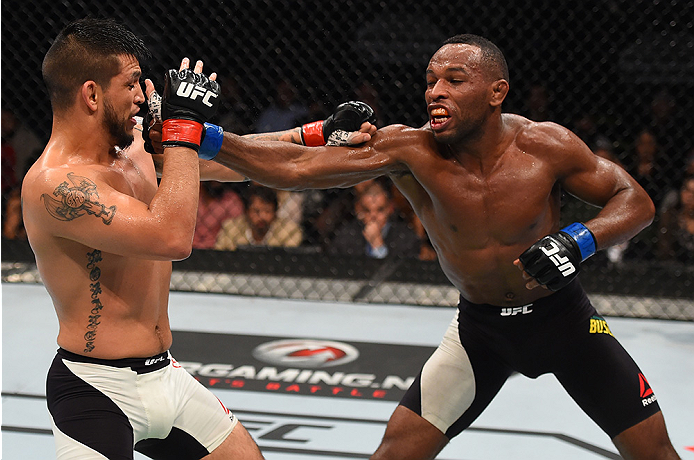 MONTERREY, MEXICO - NOVEMBER 21: (R-L) Leandro Silva of Brazil punches Efrain Escudero of Mexico in their lightweight bout during the UFC Fight Night event at Arena Monterrey on November 21, 2015 in Monterrey, Mexico. (Photo by Jeff Bottari/Zuffa LLC/Zu