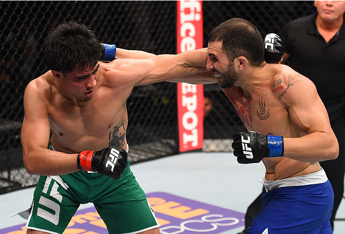 MONTERREY, MEXICO - NOVEMBER 21:  (R-L) Enrique Marin of Spain and Erick Montano of Mexico trade punches in their welterweight bout during the UFC Fight Night event at Arena Monterrey on November 21, 2015 in Monterrey, Mexico.  (Photo by Jeff Bottari/Zuff