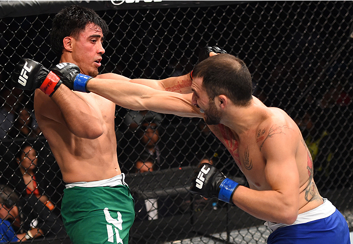 MONTERREY, MEXICO - NOVEMBER 21: (R-L) Enrique Marin of Spain punches Erick Montano of Mexico in their welterweight bout during the UFC Fight Night event at Arena Monterrey on November 21, 2015 in Monterrey, Mexico. (Photo by Jeff Bottari/Zuffa LLC/Zuff