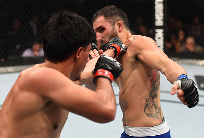 MONTERREY, MEXICO - NOVEMBER 21: (L-R) Erick Montano of Mexico punches Enrique Marin of Spain in their welterweight bout during the UFC Fight Night event at Arena Monterrey on November 21, 2015 in Monterrey, Mexico. (Photo by Jeff Bottari/Zuffa LLC/Zuff