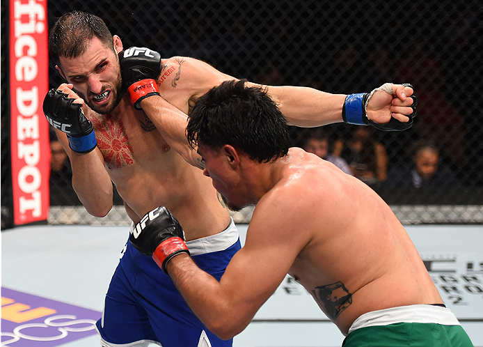 MONTERREY, MEXICO - NOVEMBER 21: (R-L) Erick Montano of Mexico punches Enrique Marin of Spain in their welterweight bout during the UFC Fight Night event at Arena Monterrey on November 21, 2015 in Monterrey, Mexico. (Photo by Jeff Bottari/Zuffa LLC/Zuff