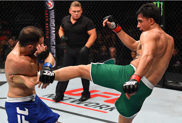 MONTERREY, MEXICO - NOVEMBER 21:  (R-L) Erick Montano of Mexico kicks Enrique Marin of Spain in their welterweight bout during the UFC Fight Night event at Arena Monterrey on November 21, 2015 in Monterrey, Mexico.  (Photo by Jeff Bottari/Zuffa LLC/Zuffa 