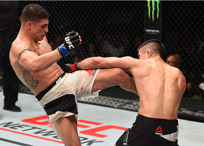 MONTERREY, MEXICO - NOVEMBER 21:  (L-R) Diego Sanchez of the United States kicks Ricardo Lamas of the United States in their featherweight bout during the UFC Fight Night event at Arena Monterrey on November 21, 2015 in Monterrey, Mexico.  (Photo by Jeff 