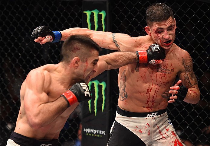 MONTERREY, MEXICO - NOVEMBER 21:  (L-R) Ricardo Lamas of the United States punches Diego Sanchez of the United States in their featherweight bout during the UFC Fight Night event at Arena Monterrey on November 21, 2015 in Monterrey, Mexico.  (Photo by Jef