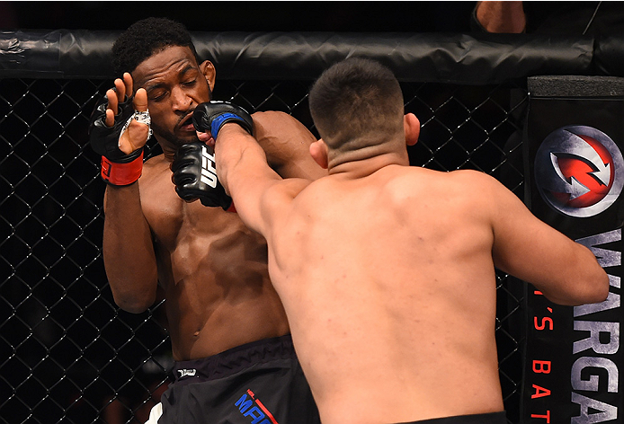 MONTERREY, MEXICO - NOVEMBER 21:  (R-L) Kelvin Gastelum of the United States punches Neil Magny of the United States in their welterweight bout during the UFC Fight Night event at Arena Monterrey on November 21, 2015 in Monterrey, Mexico.  (Photo by Jeff 