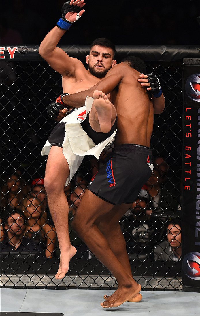 MONTERREY, MEXICO - NOVEMBER 21:  (R-L) Neil Magny of the United States takes down Kelvin Gastelum of the United States in their welterweight bout during the UFC Fight Night event at Arena Monterrey on November 21, 2015 in Monterrey, Mexico.  (Photo by Je