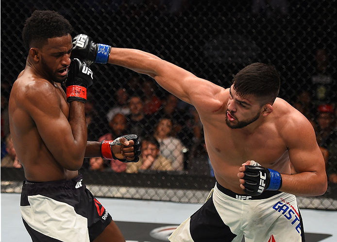 MONTERREY, MEXICO - NOVEMBER 21:  (R-L) Kelvin Gastelum of the United States punches Neil Magny of the United States in their welterweight bout during the UFC Fight Night event at Arena Monterrey on November 21, 2015 in Monterrey, Mexico.  (Photo by Jeff 