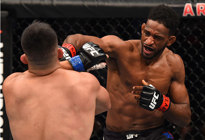 MONTERREY, MEXICO - NOVEMBER 21: (R-L) Neil Magny of the United States punches Kelvin Gastelum of the United States in their welterweight bout during the UFC Fight Night event at Arena Monterrey on November 21, 2015 in Monterrey, Mexico. (Photo by Jeff