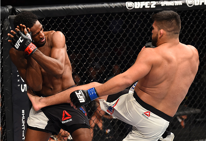 MONTERREY, MEXICO - NOVEMBER 21:  (R-L) Kelvin Gastelum of the United States kicks Neil Magny of the United States in their welterweight bout during the UFC Fight Night event at Arena Monterrey on November 21, 2015 in Monterrey, Mexico.  (Photo by Jeff Bo