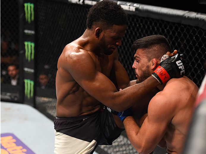 MONTERREY, MEXICO - NOVEMBER 21:  (L-R) Neil Magny of the United States knees Kelvin Gastelum of the United States in their welterweight bout during the UFC Fight Night event at Arena Monterrey on November 21, 2015 in Monterrey, Mexico.  (Photo by Jeff Bo