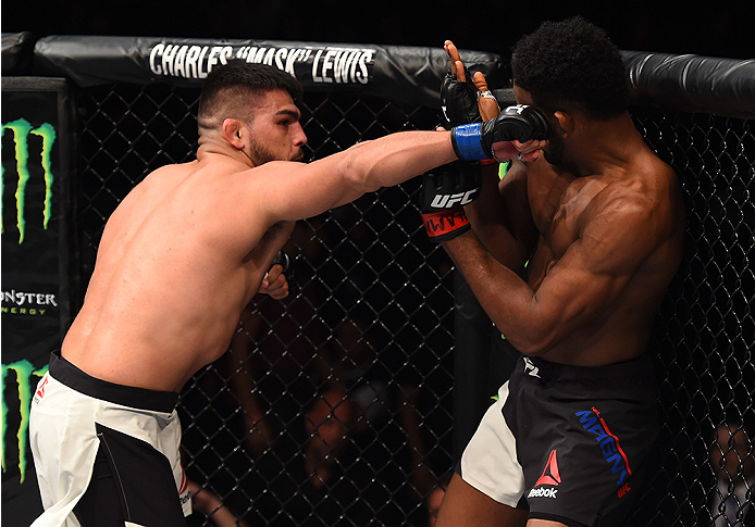 MONTERREY, MEXICO - NOVEMBER 21: (L-R) Kelvin Gastelum of the United States punches Neil Magny of the United States in their welterweight bout during the UFC Fight Night event at Arena Monterrey on November 21, 2015 in Monterrey, Mexico. (Photo by Jeff