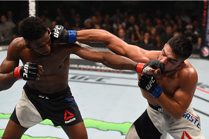 MONTERREY, MEXICO - NOVEMBER 21: (L-R) Neil Magny of the United States and Kelvin Gastelum of the United States trade punches in their welterweight bout during the UFC Fight Night event at Arena Monterrey on November 21, 2015 in Monterrey, Mexico. (Phot