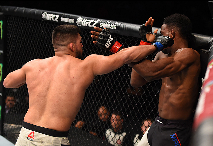 MONTERREY, MEXICO - NOVEMBER 21:  (L-R) Kelvin Gastelum of the United States punches Neil Magny of the United States in their welterweight bout during the UFC Fight Night event at Arena Monterrey on November 21, 2015 in Monterrey, Mexico.  (Photo by Jeff 