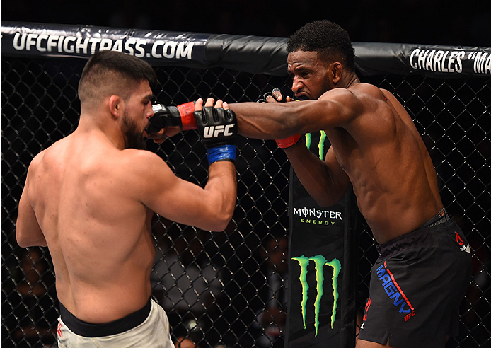 MONTERREY, MEXICO - NOVEMBER 21: (R-L) Neil Magny of the United States punches Kelvin Gastelum of the United States in their welterweight bout during the UFC Fight Night event at Arena Monterrey on November 21, 2015 in Monterrey, Mexico. (Photo by Jeff