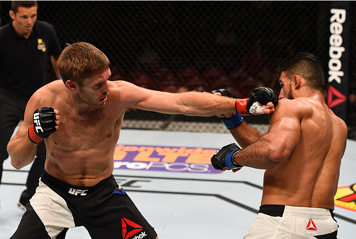 SAN DIEGO, CA - JULY 15:   (L-R) Andrew Craig punches Lyman Good in their middleweight bout during the UFC event at the Valley View Casino Center on July 15, 2015 in San Diego, California. (Photo by Jeff Bottari/Zuffa LLC/Zuffa LLC via Getty Images)