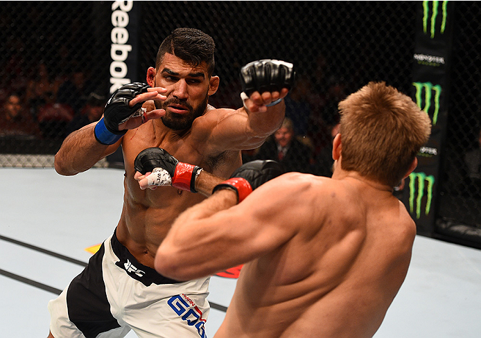 SAN DIEGO, CA - JULY 15:   (L-R) Lyman Good punches Andrew Craig in their middleweight bout during the UFC event at the Valley View Casino Center on July 15, 2015 in San Diego, California. (Photo by Jeff Bottari/Zuffa LLC/Zuffa LLC via Getty Images)