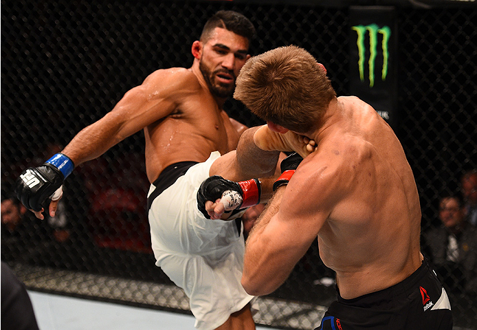 SAN DIEGO, CA - JULY 15:   (L-R) Lyman Good kicks Andrew Craig in their middleweight bout during the UFC event at the Valley View Casino Center on July 15, 2015 in San Diego, California. (Photo by Jeff Bottari/Zuffa LLC/Zuffa LLC via Getty Images)