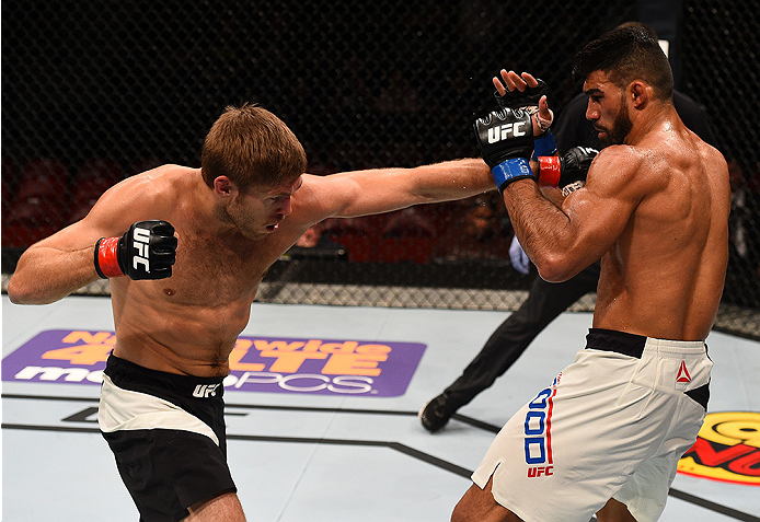 SAN DIEGO, CA - JULY 15:   (L-R) Andrew Craig punches Lyman Good in their middleweight bout during the UFC event at the Valley View Casino Center on July 15, 2015 in San Diego, California. (Photo by Jeff Bottari/Zuffa LLC/Zuffa LLC via Getty Images)