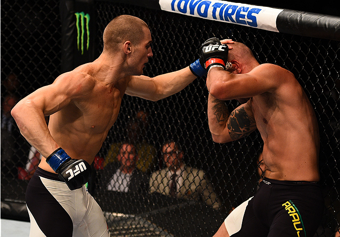 SAN DIEGO, CA - JULY 15:   (L-R) Sean Strickland punches Igor Araujo of Brazil in their welterweight bout during the UFC event at the Valley View Casino Center on July 15, 2015 in San Diego, California. (Photo by Jeff Bottari/Zuffa LLC/Zuffa LLC via Getty