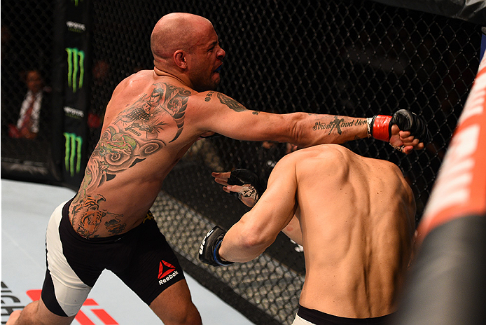 SAN DIEGO, CA - JULY 15:   (L-R) Igor Araujo of Brazil punches Sean Strickland in their welterweight bout during the UFC event at the Valley View Casino Center on July 15, 2015 in San Diego, California. (Photo by Jeff Bottari/Zuffa LLC/Zuffa LLC via Getty