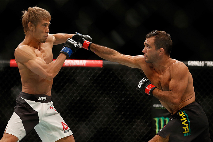 SAN DIEGO, CA - JULY 15: (R-L) Rani Yahya of Brazil punches Masanori Kanehara of Japan in their bantamweight bout during the UFC event at the Valley View Casino Center on July 15, 2015 in San Diego, California.(Photo by Todd Warshaw/Zuffa LLC/Zuffa LLC v
