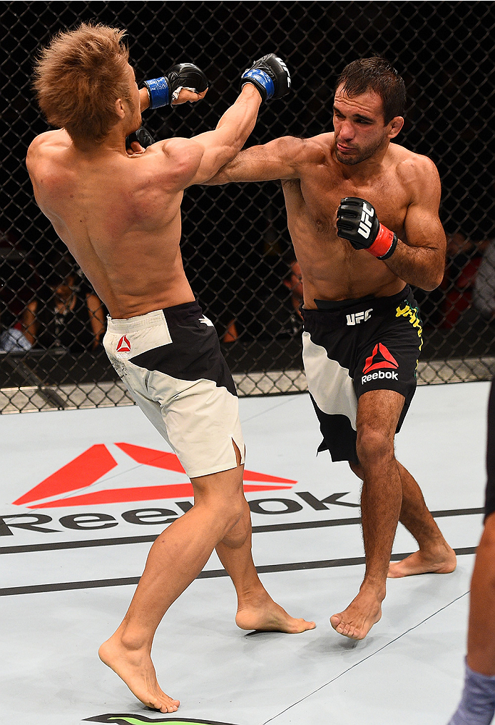 SAN DIEGO, CA - JULY 15: (R-L) Rani Yahya of Brazil punches Masanori Kanehara of Japan in their bantamweight bout during the UFC event at the Valley View Casino Center on July 15, 2015 in San Diego, California. (Photo by Jeff Bottari/Zuffa LLC/Zuffa LLC
