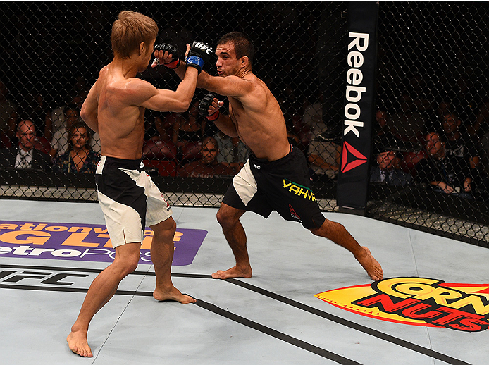 SAN DIEGO, CA - JULY 15: (R-L) Rani Yahya of Brazil punches Masanori Kanehara of Japan in their bantamweight bout during the UFC event at the Valley View Casino Center on July 15, 2015 in San Diego, California. (Photo by Jeff Bottari/Zuffa LLC/Zuffa LLC