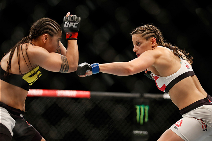 SAN DIEGO, CA - JULY 15:   (R-L) Sarah Moras of Canada punches Jessica Andrade of Brazil in their women's bantamweight bout during the UFC event at the Valley View Casino Center on July 15, 2015 in San Diego, California. (Photo by Todd Warshaw/Zuffa LLC/Z