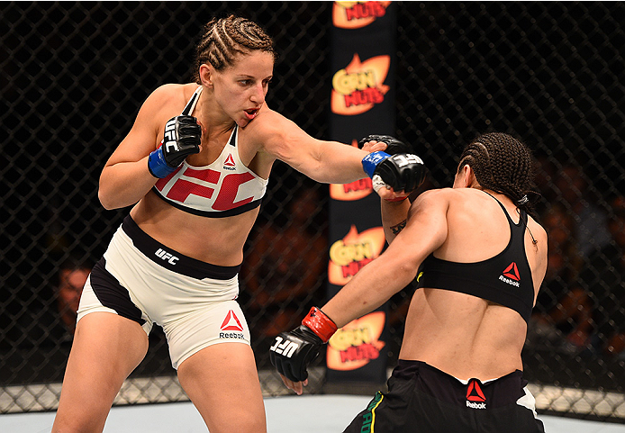 SAN DIEGO, CA - JULY 15:   (L-R) Sarah Moras of Canada punches Jessica Andrade of Brazil in their women's bantamweight bout during the UFC event at the Valley View Casino Center on July 15, 2015 in San Diego, California. (Photo by Jeff Bottari/Zuffa LLC/Z