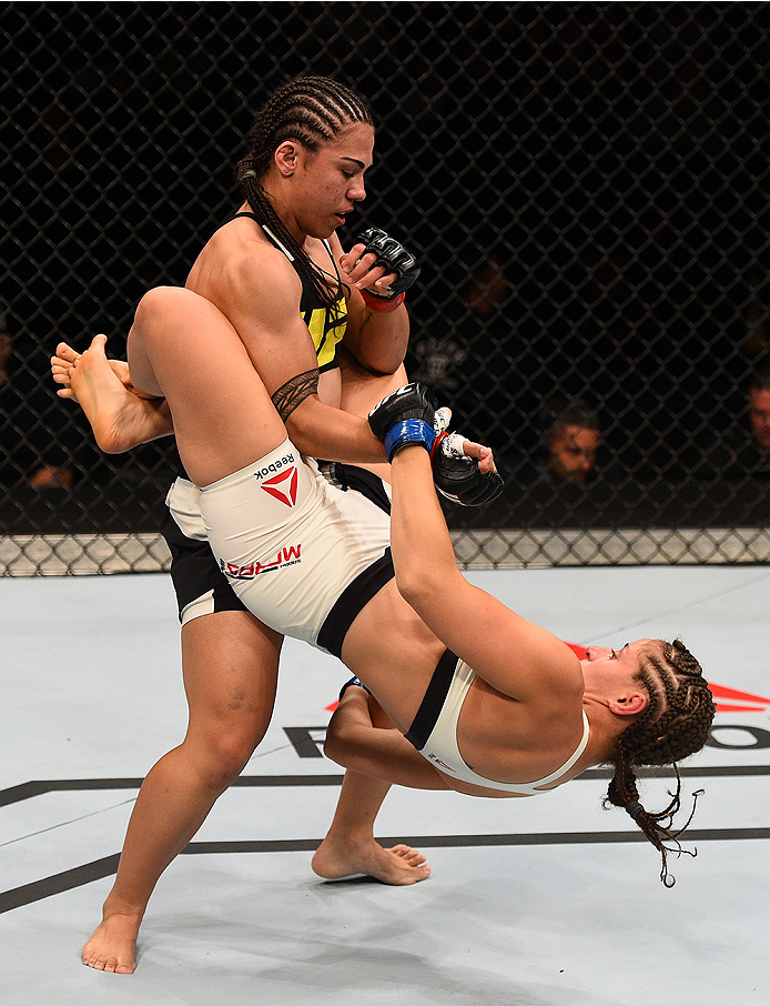 SAN DIEGO, CA - JULY 15:   (R-L) Sarah Moras of Canada attempts to submit Jessica Andrade of Brazil in their women's bantamweight bout during the UFC event at the Valley View Casino Center on July 15, 2015 in San Diego, California. (Photo by Jeff Bottari/