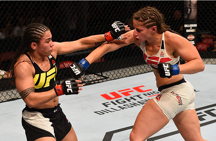 SAN DIEGO, CA - JULY 15:   (R-L) Sarah Moras of Canada punches Jessica Andrade of Brazil in their women's bantamweight bout during the UFC event at the Valley View Casino Center on July 15, 2015 in San Diego, California. (Photo by Jeff Bottari/Zuffa LLC/Z