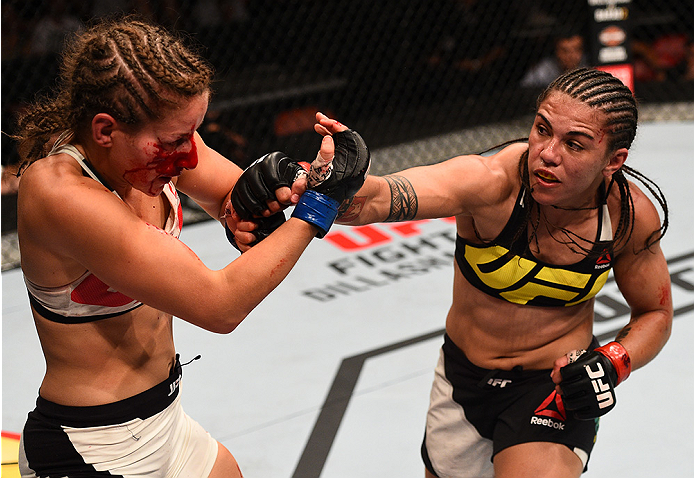 SAN DIEGO, CA - JULY 15:   (R-L) Jessica Andrade of Brazil punches Sarah Moras of Canada in their women's bantamweight bout during the UFC event at the Valley View Casino Center on July 15, 2015 in San Diego, California. (Photo by Jeff Bottari/Zuffa LLC/Z