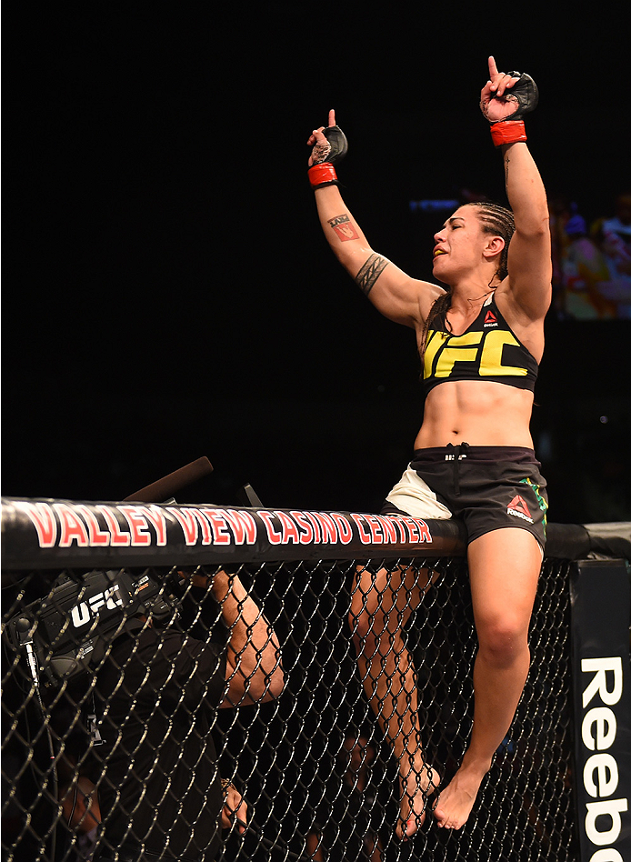 SAN DIEGO, CA - JULY 15:   Jessica Andrade of Brazil celebrates her victory over Sarah Moras of Canada in their women's bantamweight bout during the UFC event at the Valley View Casino Center on July 15, 2015 in San Diego, California. (Photo by Jeff Botta