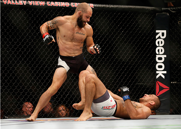 SAN DIEGO, CA - JULY 15:   Sam Sicilia (top) punches Yaotzin Meza in their featherweight bout during the UFC event at the Valley View Casino Center on July 15, 2015 in San Diego, California.  (Photo by Todd Warshaw/Zuffa LLC/Zuffa LLC via Getty Images)