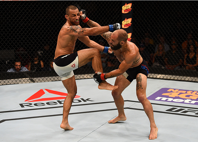 SAN DIEGO, CA - JULY 15:   (R-L) Sam Sicilia punches Yaotzin Meza in their featherweight bout during the UFC event at the Valley View Casino Center on July 15, 2015 in San Diego, California. (Photo by Jeff Bottari/Zuffa LLC/Zuffa LLC via Getty Images)