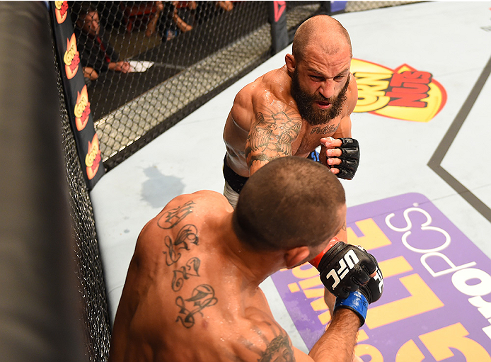 SAN DIEGO, CA - JULY 15:   (R-L) Sam Sicilia punches Yaotzin Meza in their featherweight bout during the UFC event at the Valley View Casino Center on July 15, 2015 in San Diego, California. (Photo by Jeff Bottari/Zuffa LLC/Zuffa LLC via Getty Images)