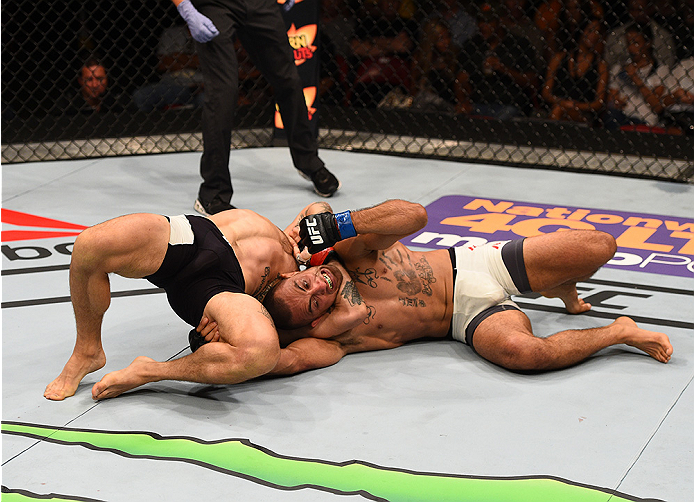 SAN DIEGO, CA - JULY 15:   Sam Sicilia (top) attempts to submit Yaotzin Meza in their featherweight bout during the UFC event at the Valley View Casino Center on July 15, 2015 in San Diego, California. (Photo by Jeff Bottari/Zuffa LLC/Zuffa LLC via Getty 